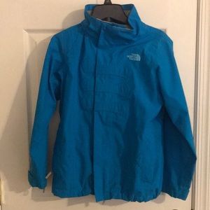 Girls light North Face jacket.